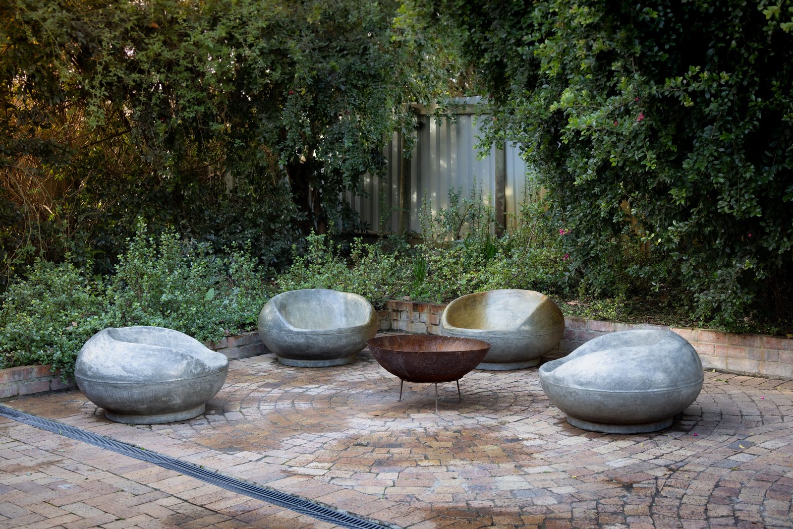 Wet stone patio paving after pressure washing